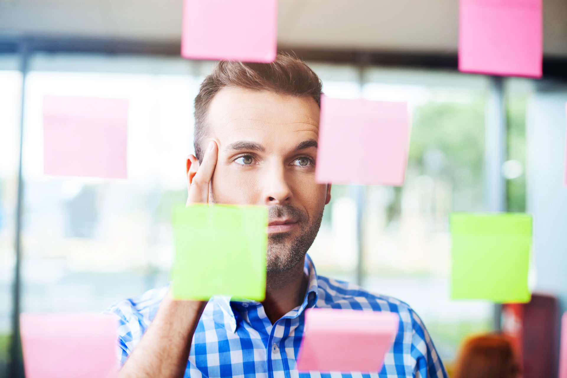 man looking at notes