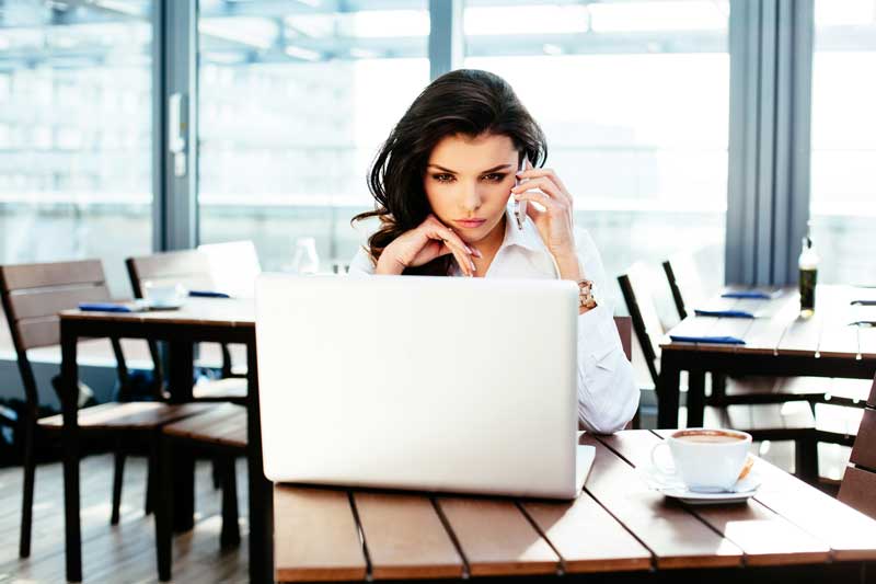 woman looking at laptop